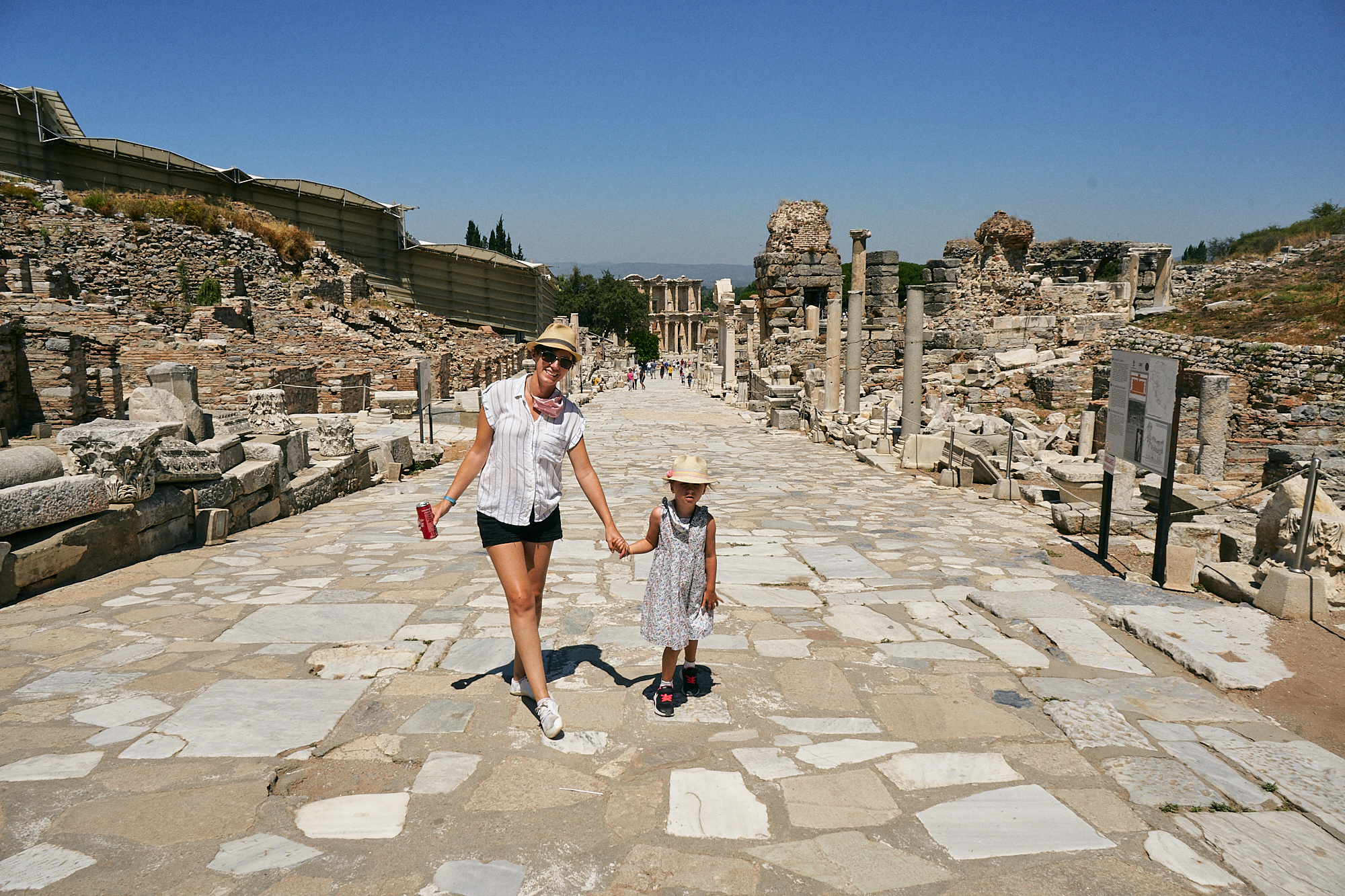 mum and daughter pose on quiet street in Ephesus