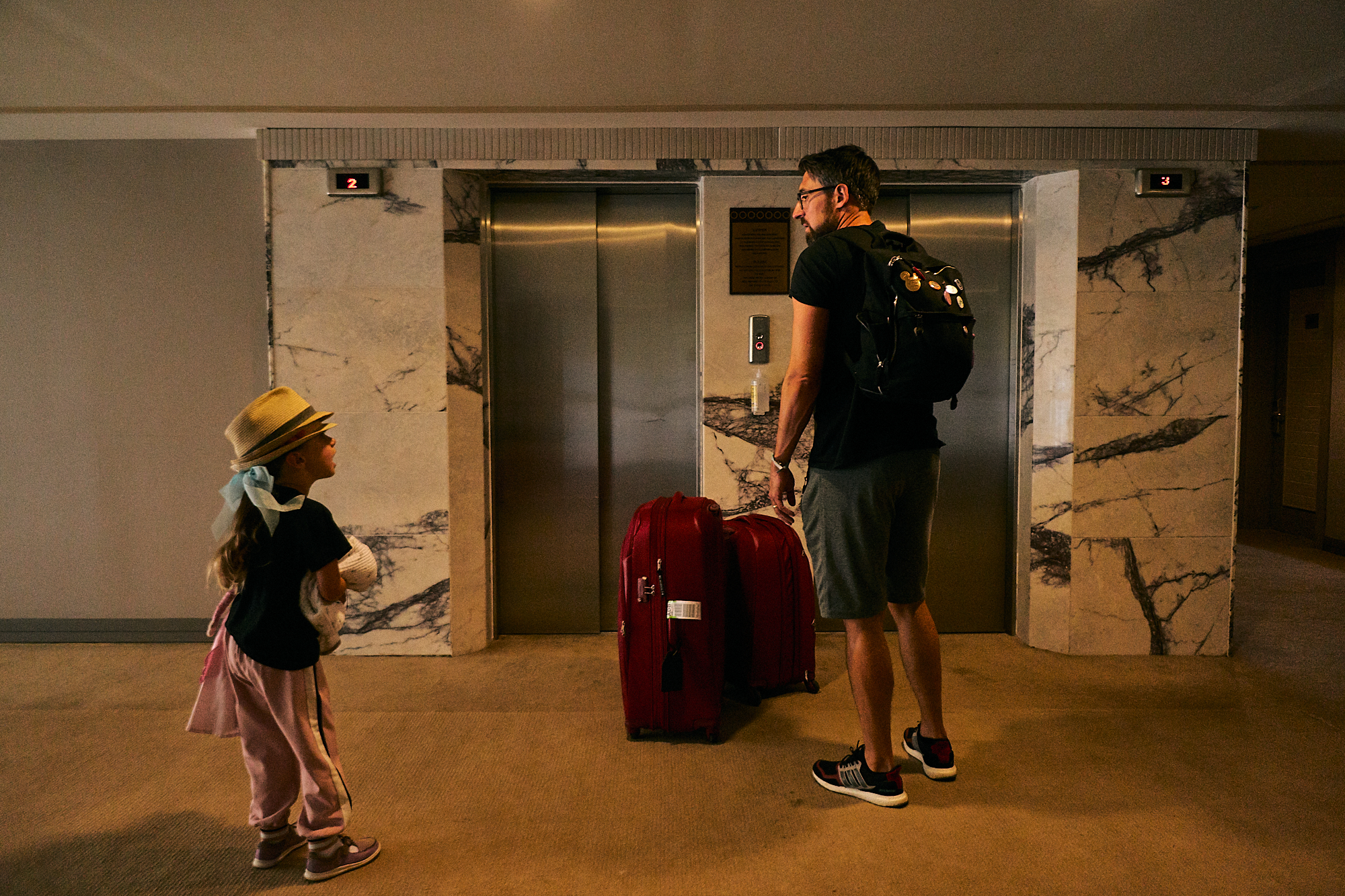 family wait for lift to leave holiday at Fantasia Hotel