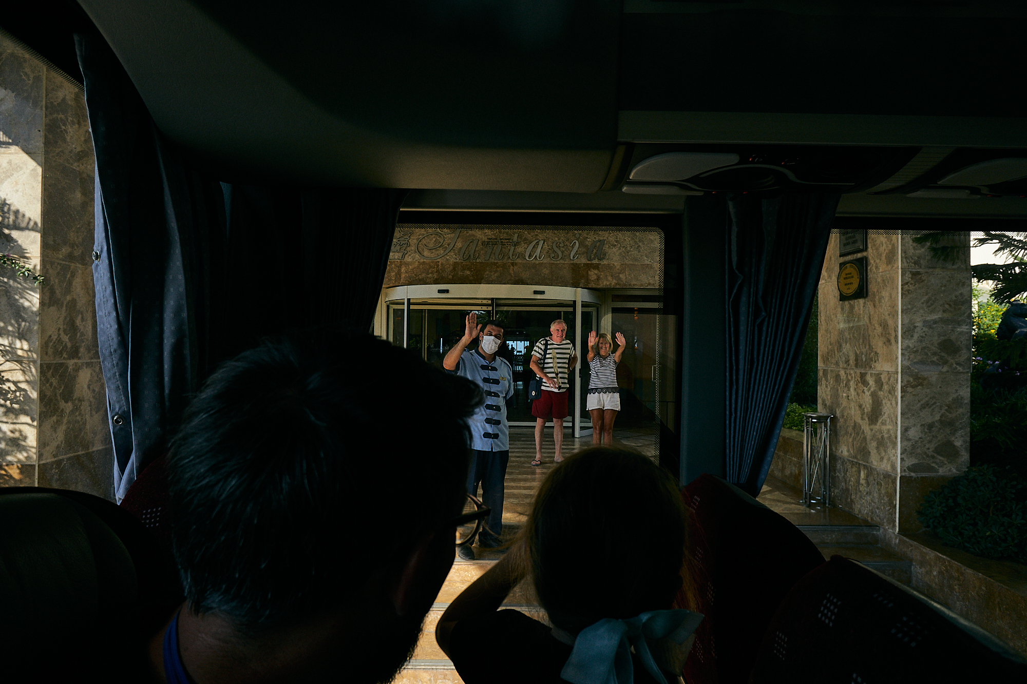 hotel guests and porter wave to guests leave Fantasia