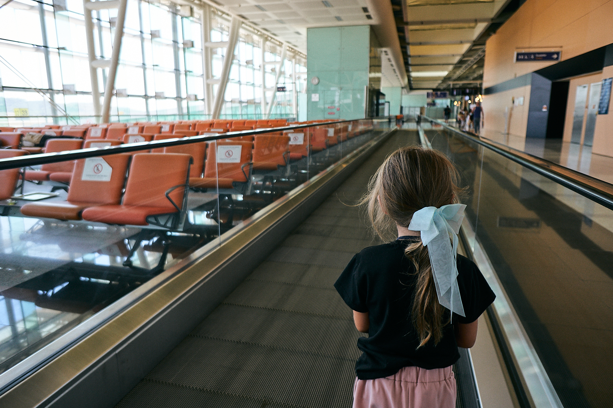 girl in a very quiet Ismir airport during Coronavirus