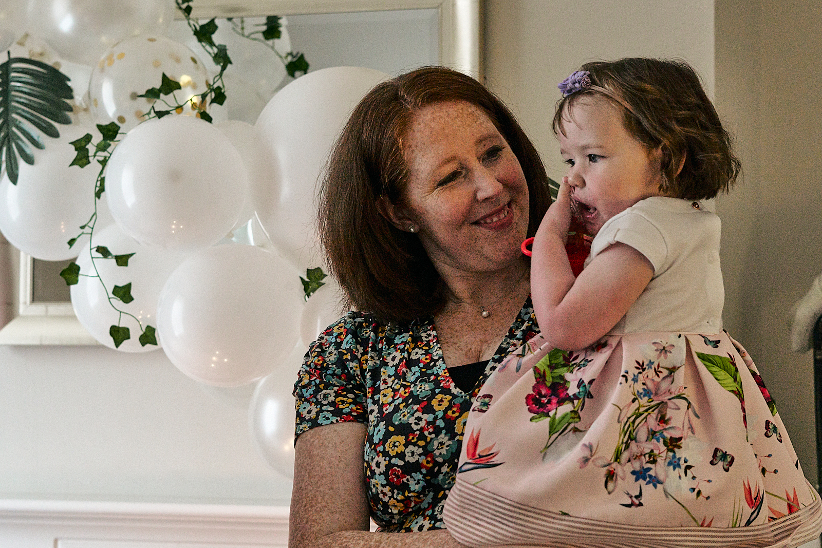 mum smiles at daughter during lockdown naming day