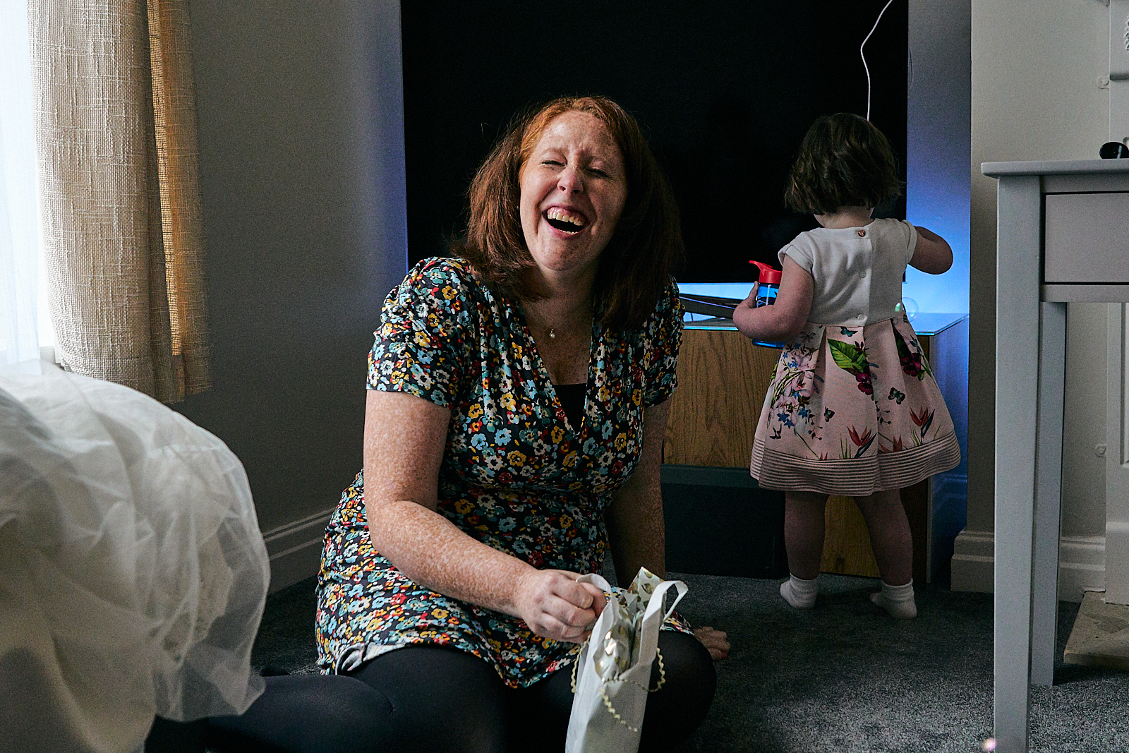 mum laughs at clever daughter with bubble machine