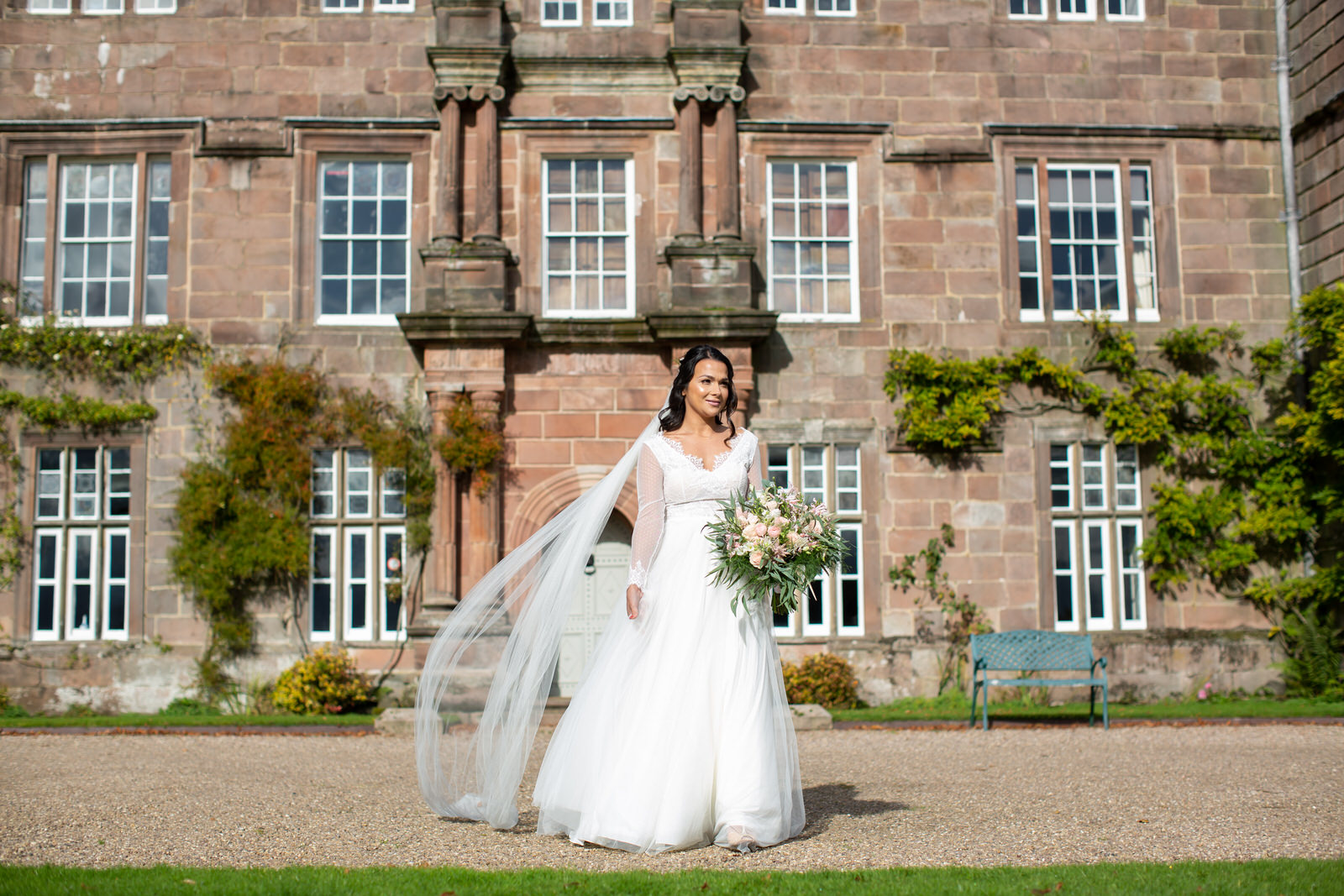 wind blows brides veil outside Browsholme hall Lancashire