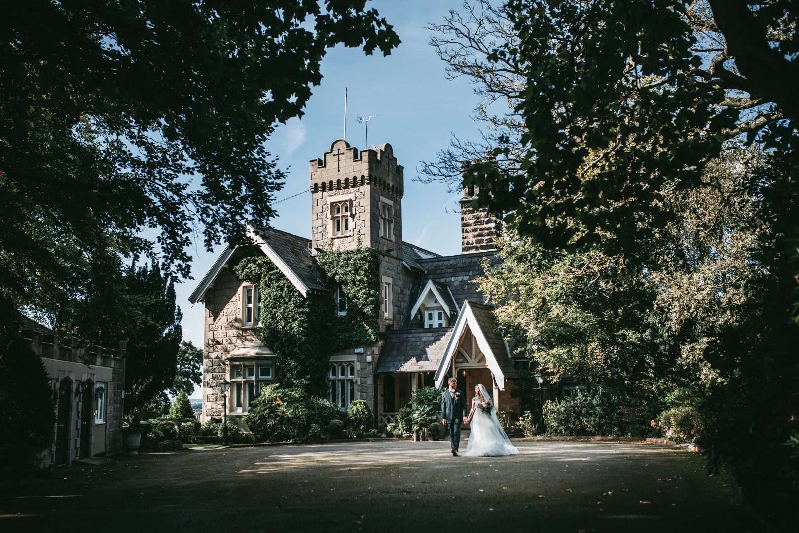 photo of front of west tower with bride and groom