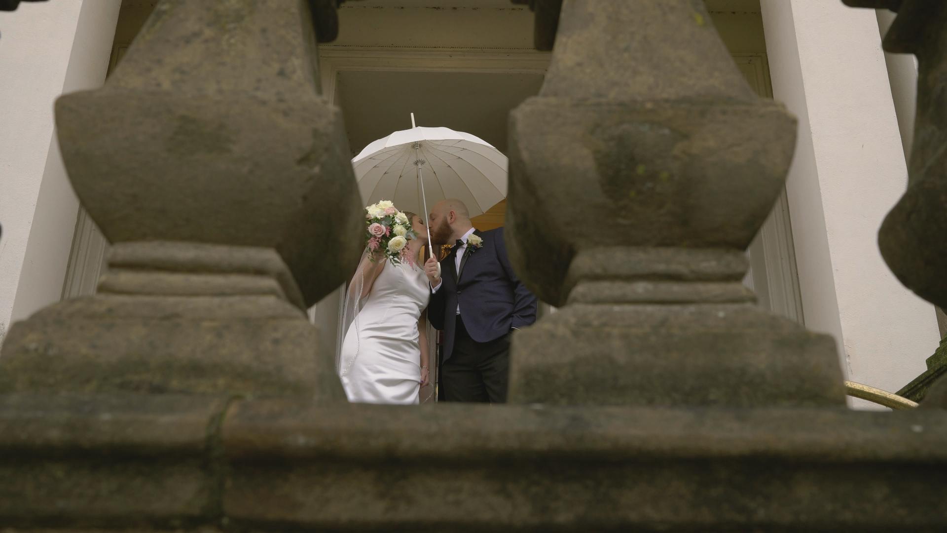 couple pose for video after micro wedding at Southport Town Hall