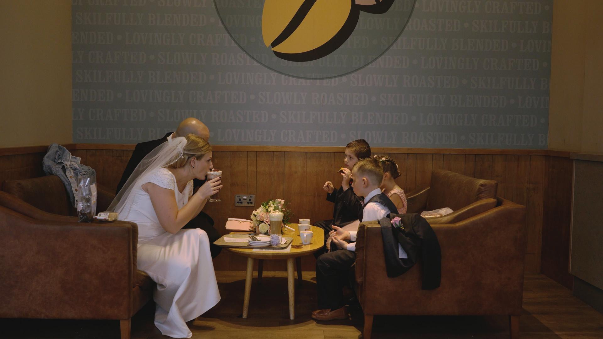 bride and groom drink hot chocolate in Costa southport