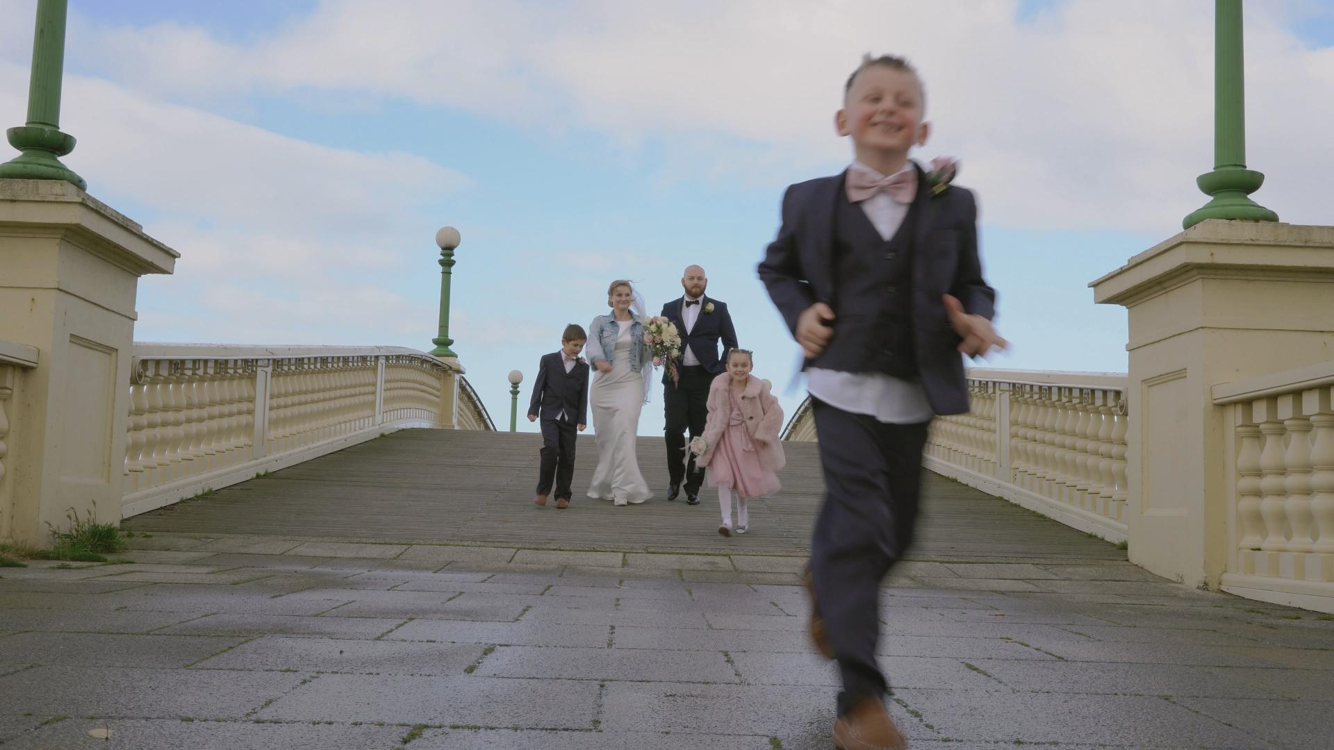 bride and groom with children in southport