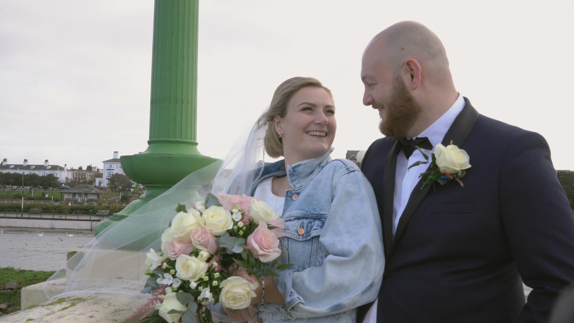 bride in denim jacket by southport pier