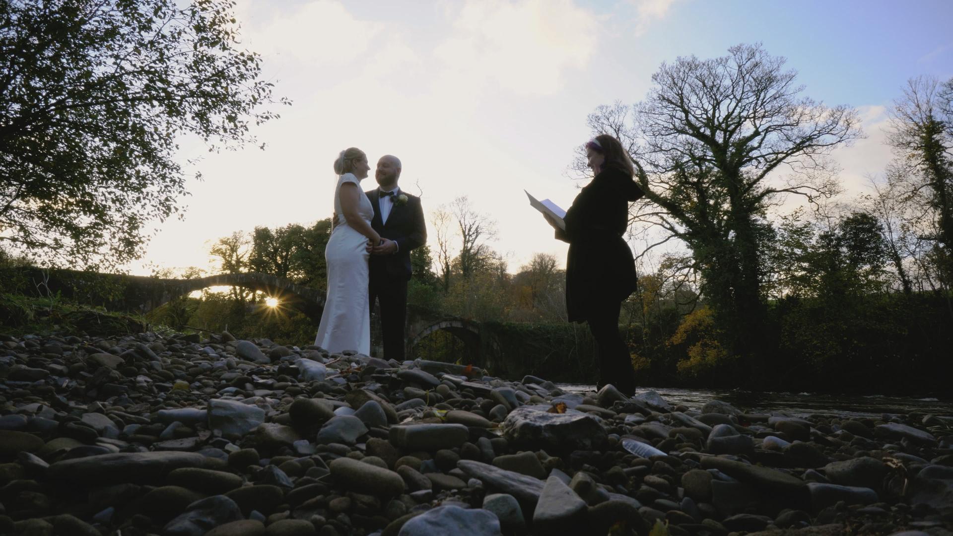 celebrant ceremony by river with sunkissed ceremonies