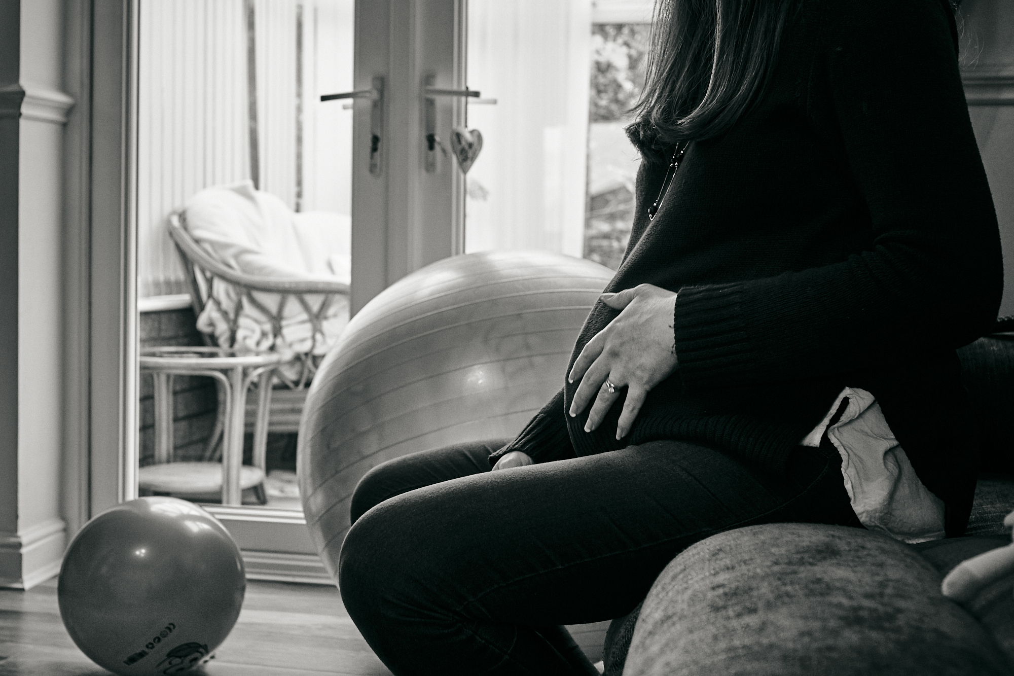 mum places hand on growing bump in cheshire