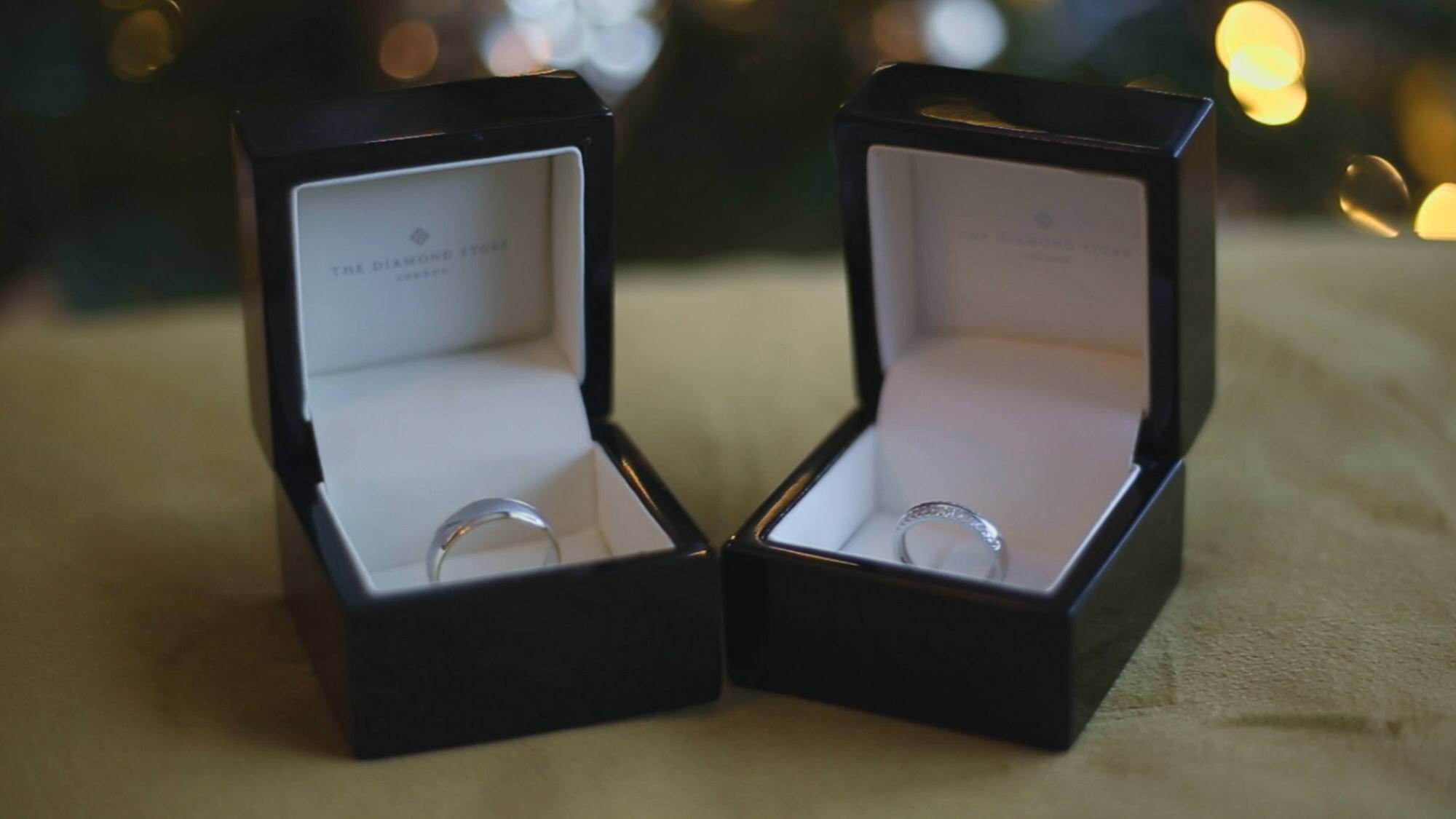 video still of wedding rings by christmas tree
