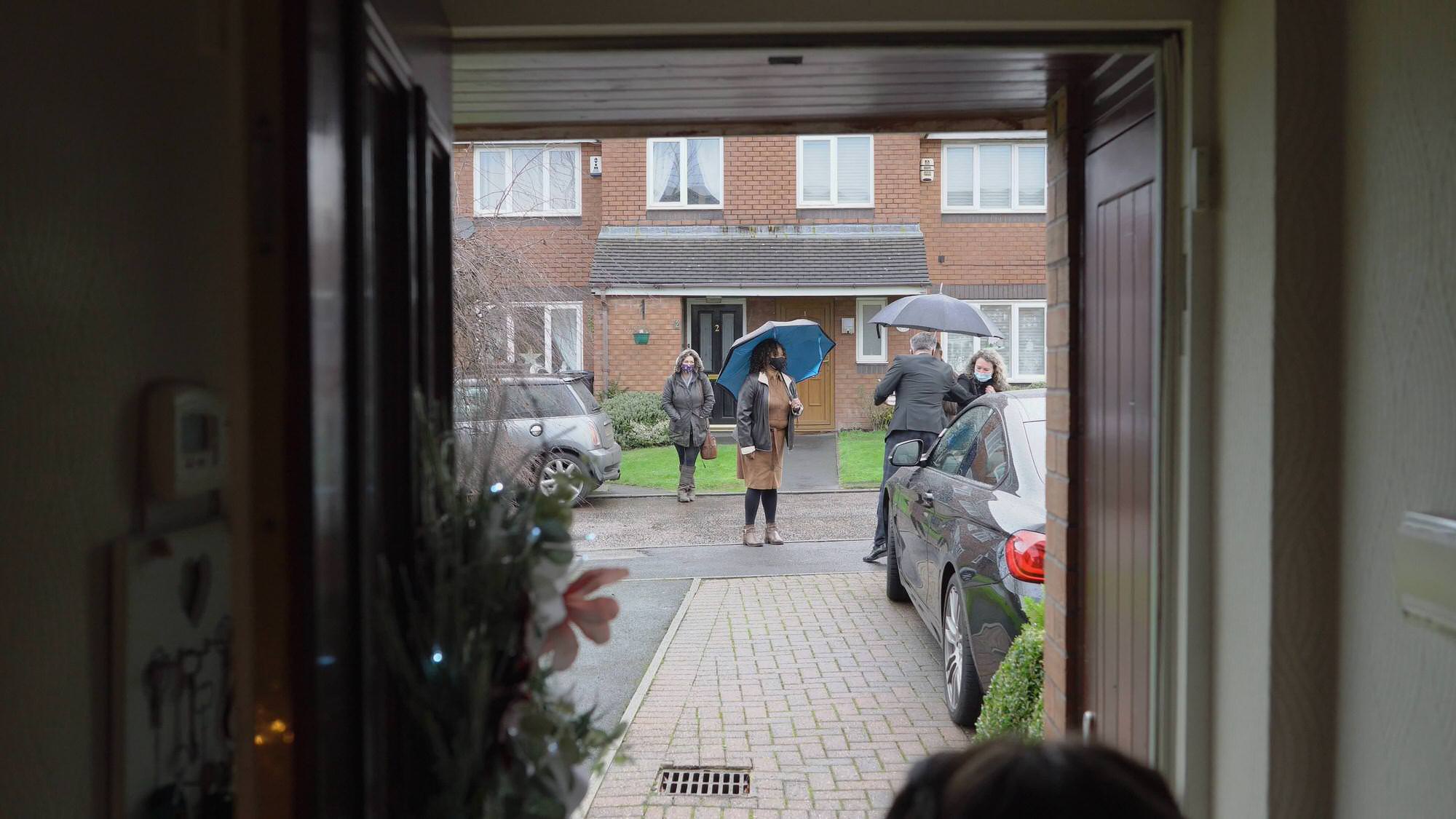 socially distanced neighbours wait for bride to leave in Preston