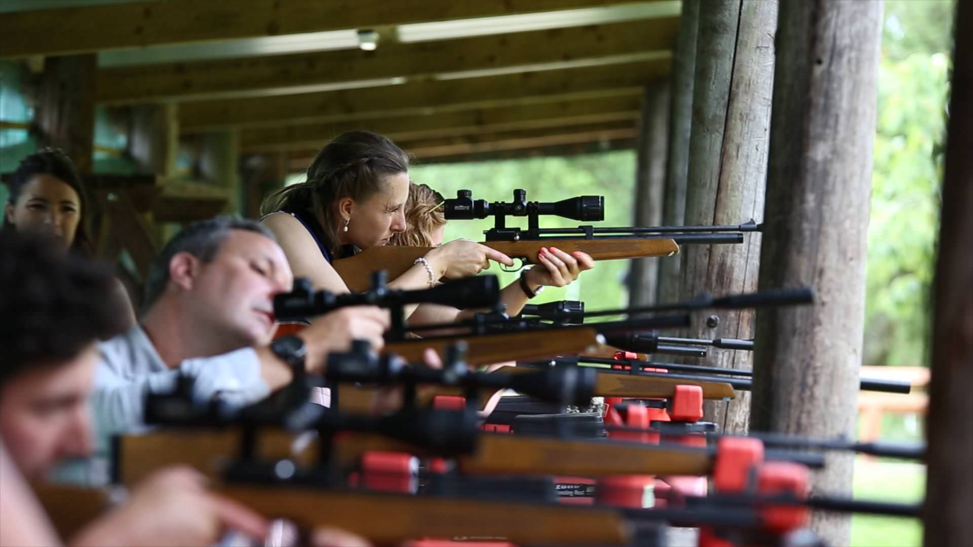 wedding guests at shooting range during cheshire wedding