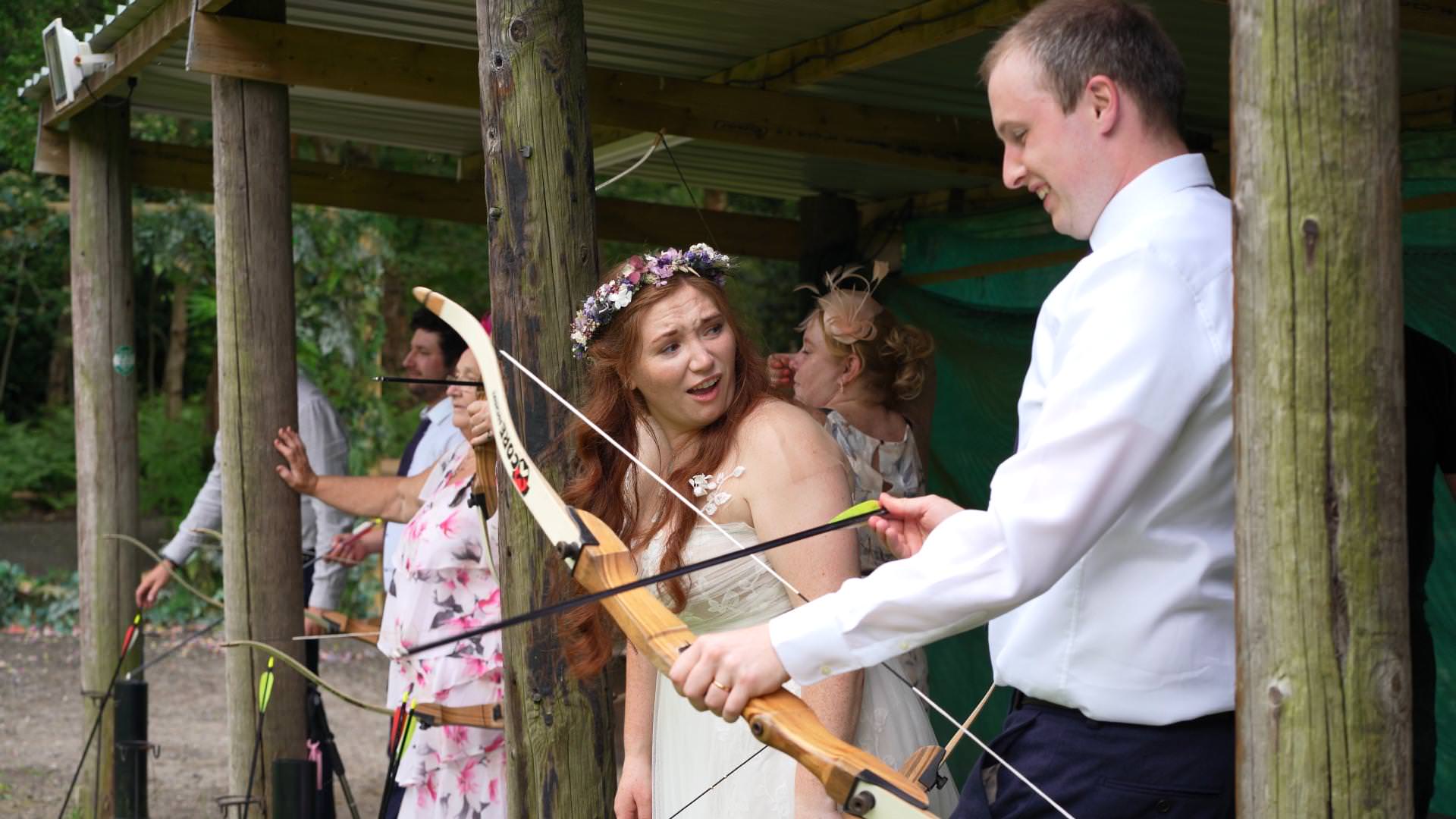 bride reacts to missing archery target at outdoor wedding