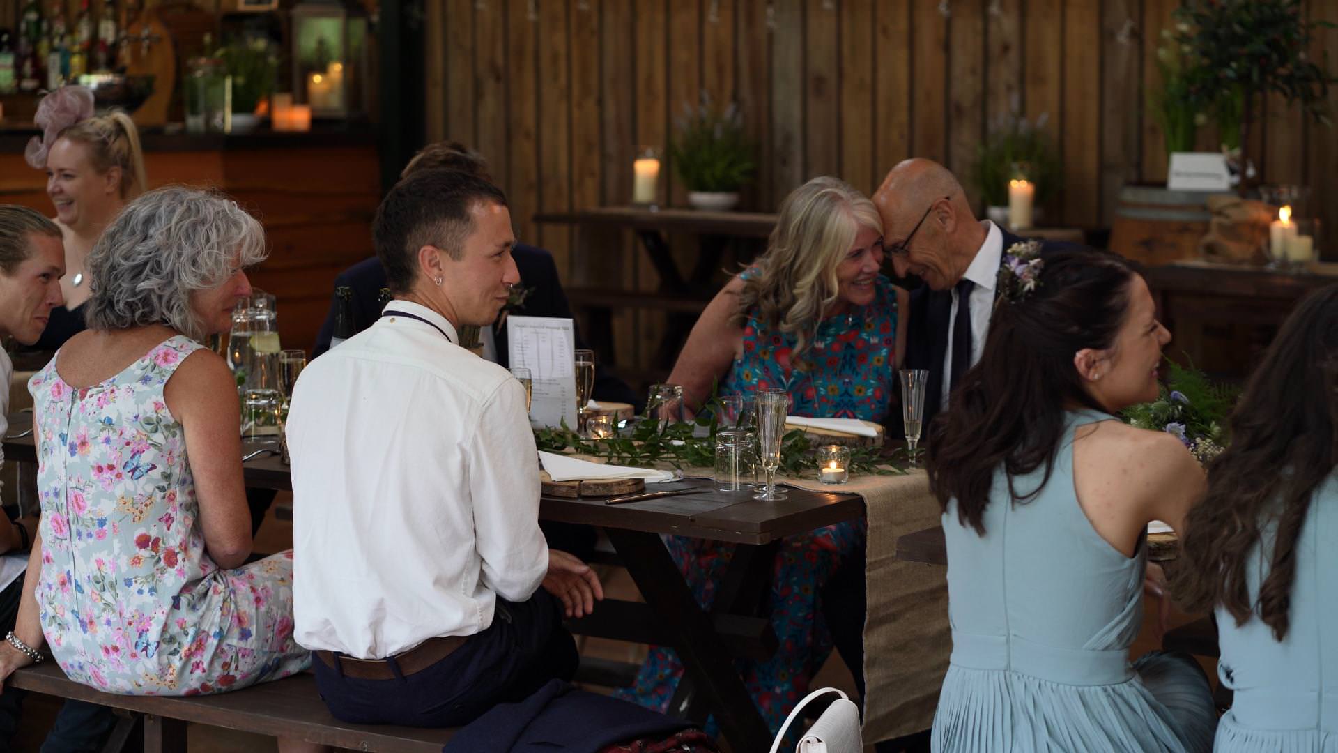 parents enjoy a moment during reception at cheshire woodland weddings