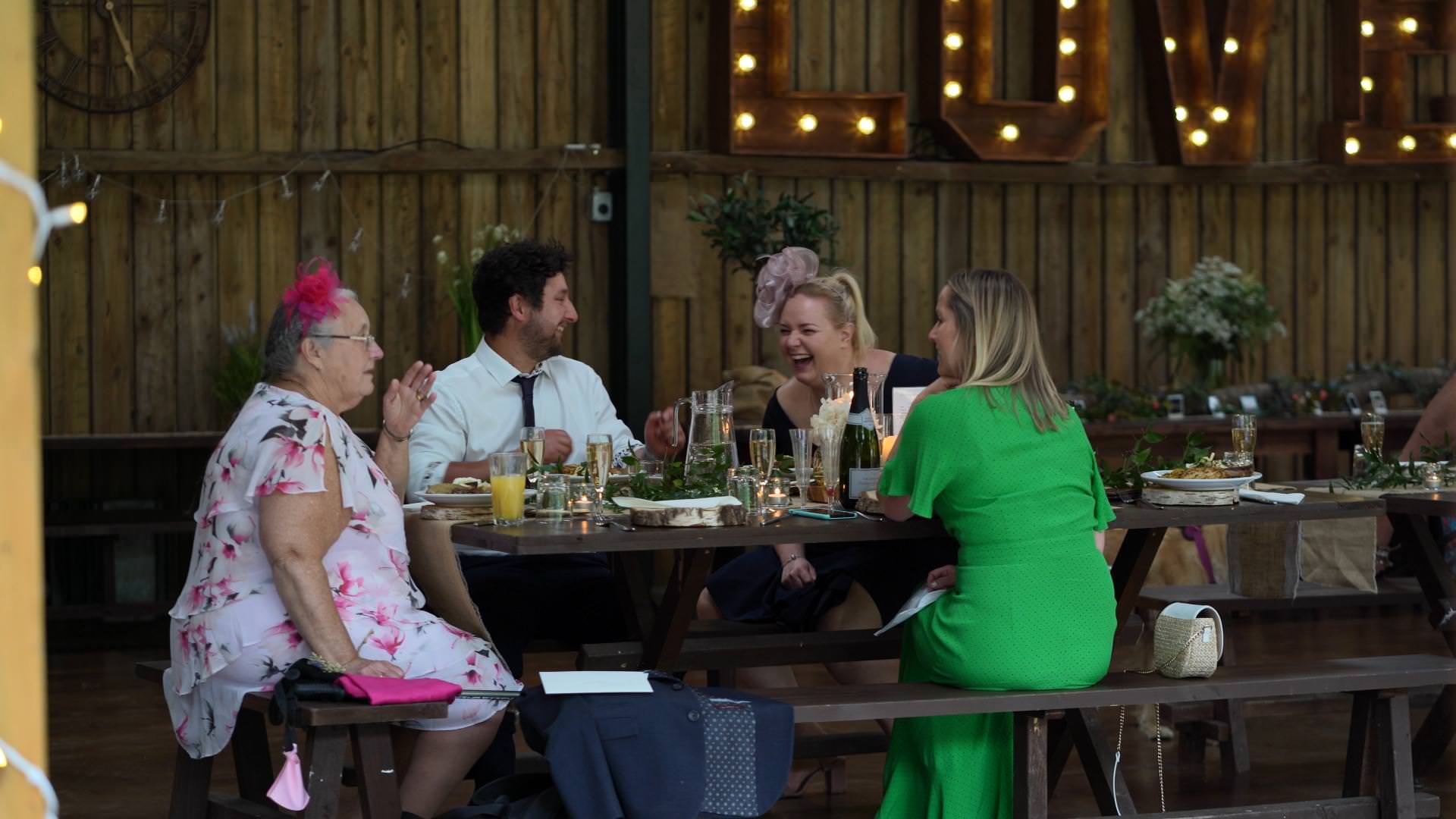 wedding guests laughing during cheshire wedding reception