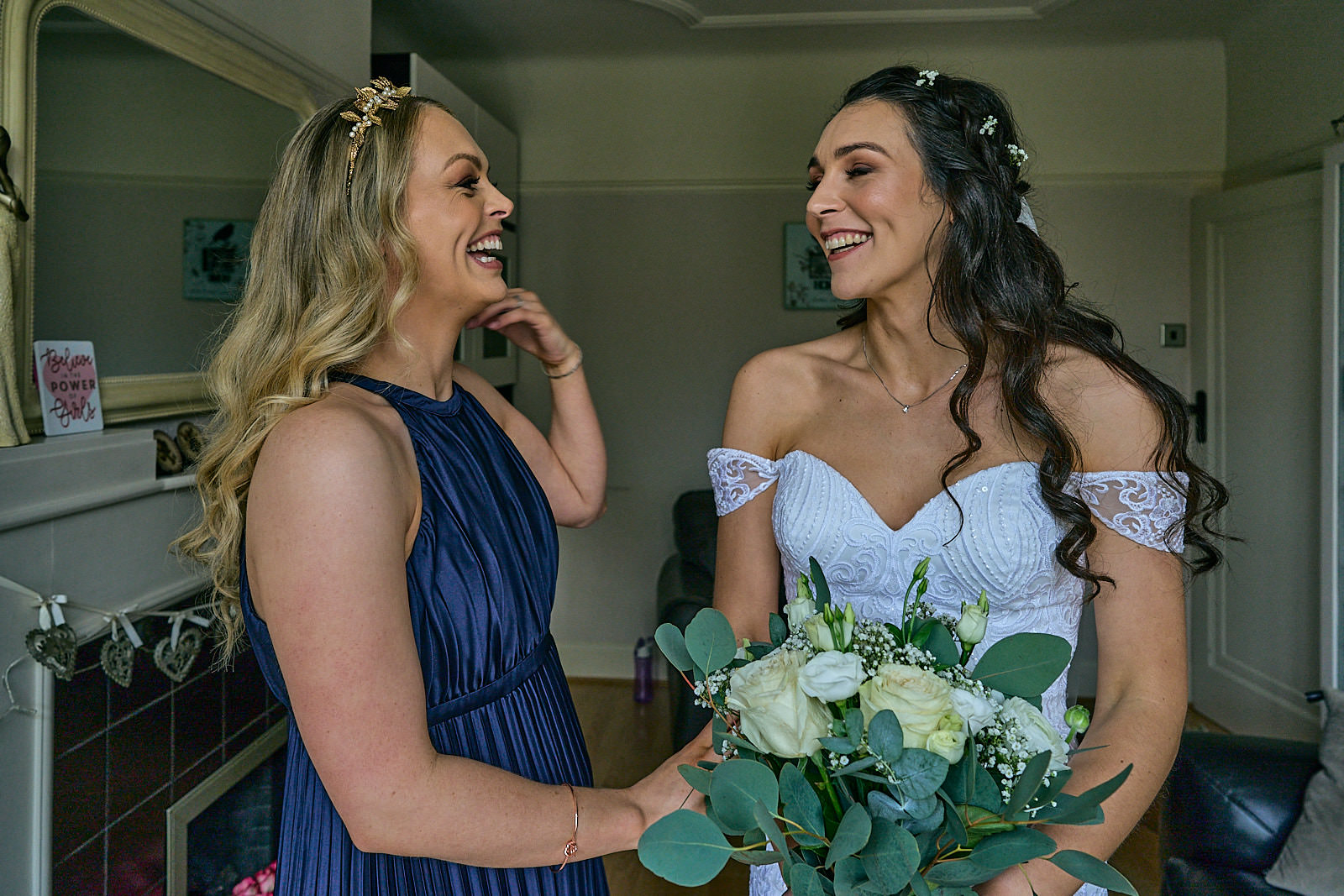 relaxed unposed photo of bride with her bridesmaid sister in Crosby