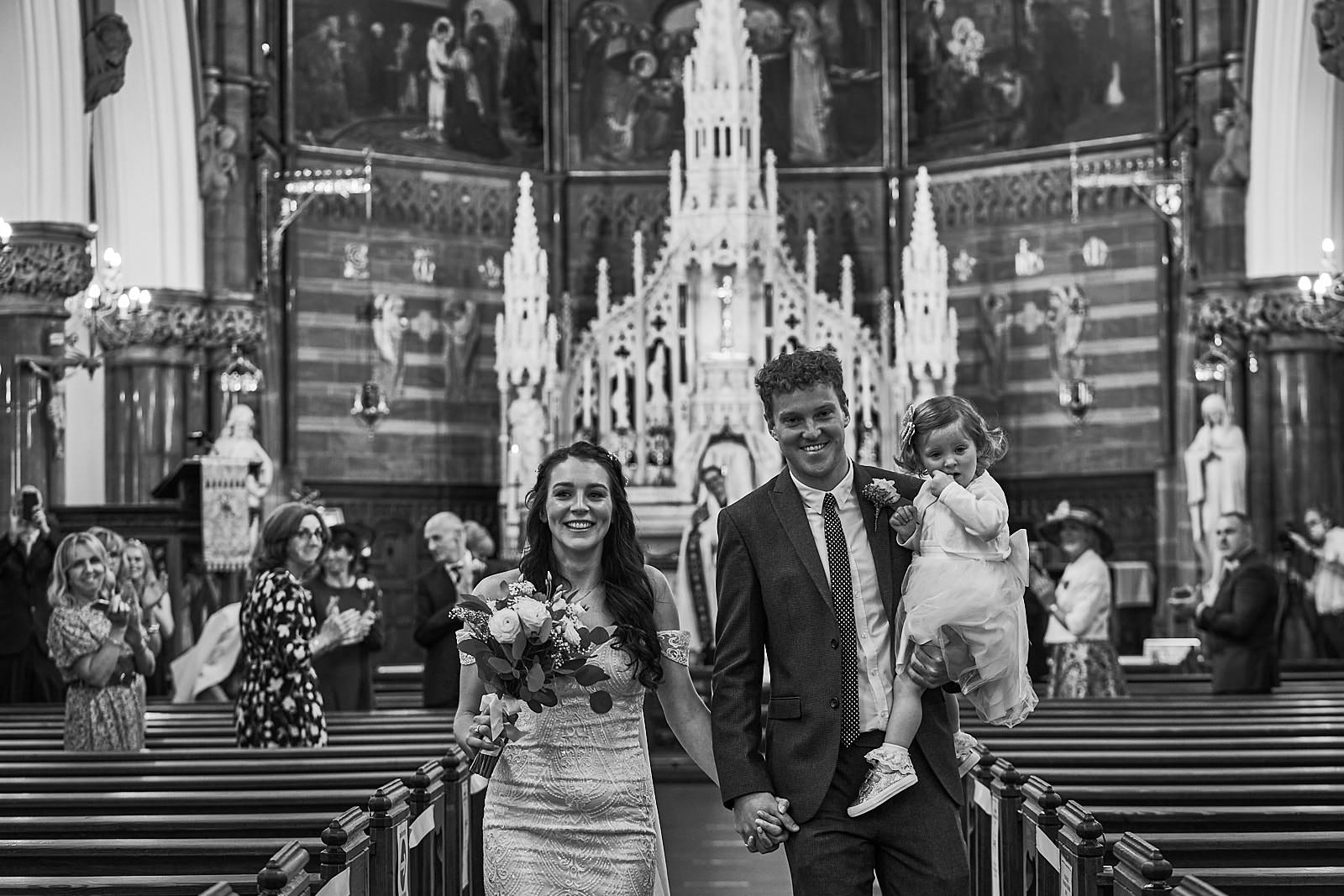 natural photo of happy couple married in church near Liverpool