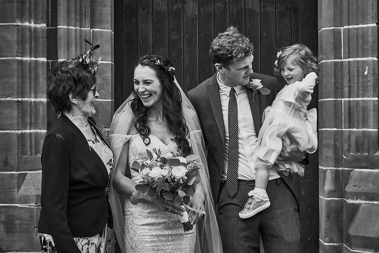 informal and relaxed wedding group shot outside church