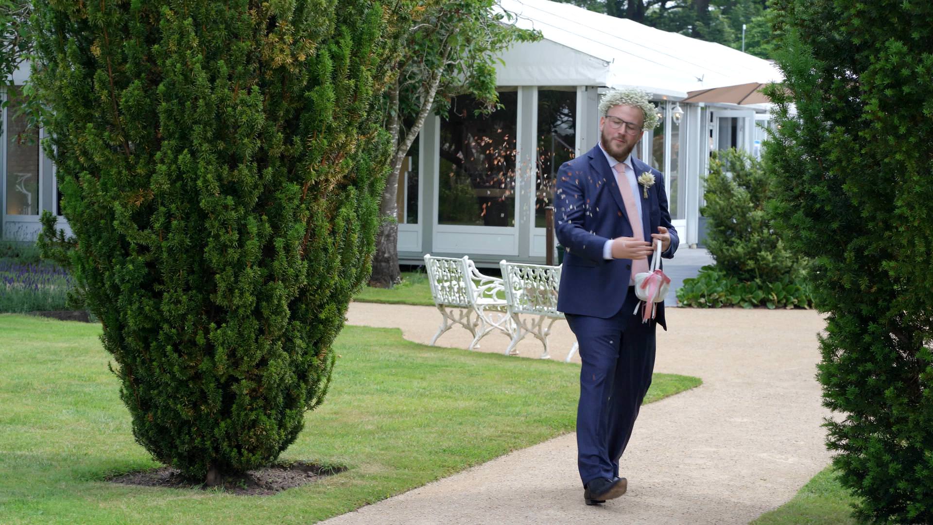 flower dude scatters petals during ceremony