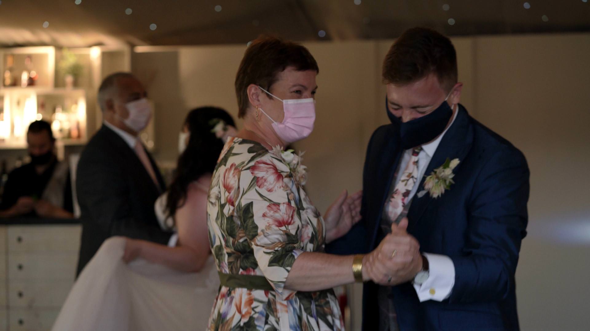 covid masks worn during parents dance at wedding