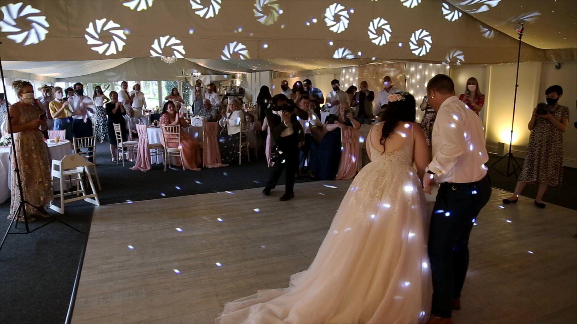 couple cut cake at Combermere Abbey