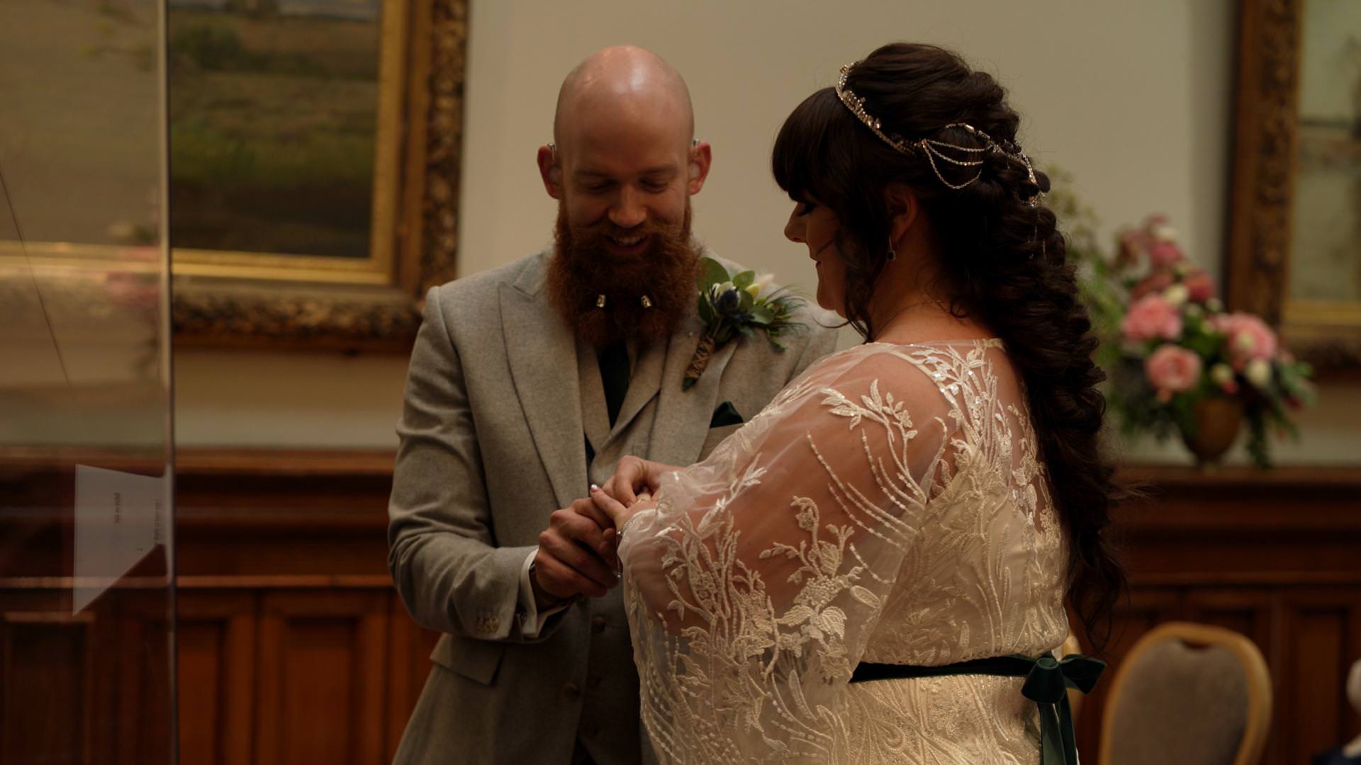 bride and groom saying vows during wedding