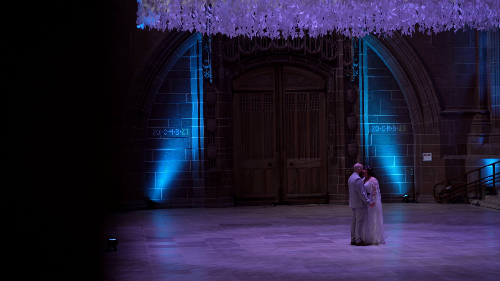 video still of newlywed couple under Peace Doves