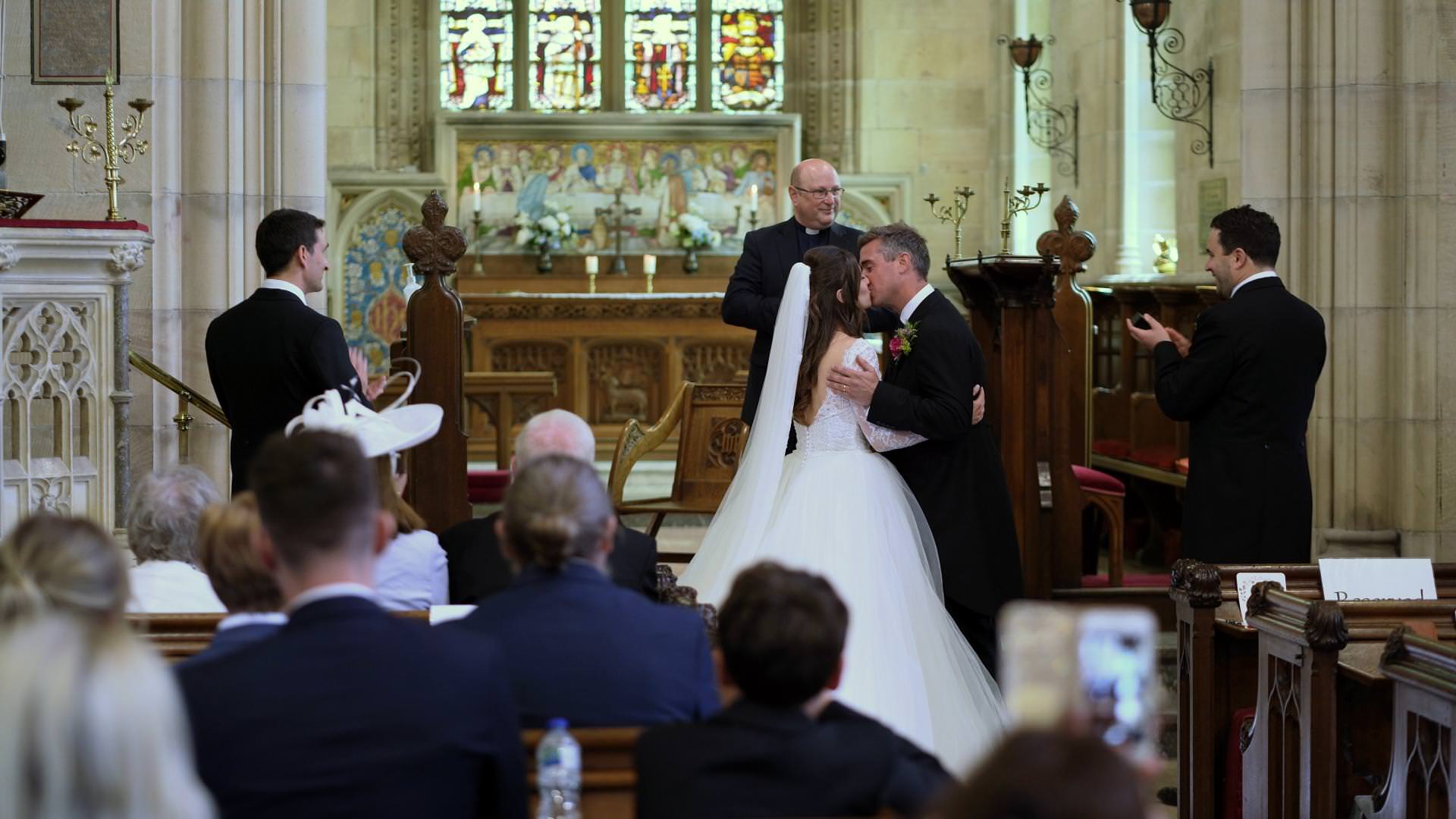 couple kiss at Osmaston village church
