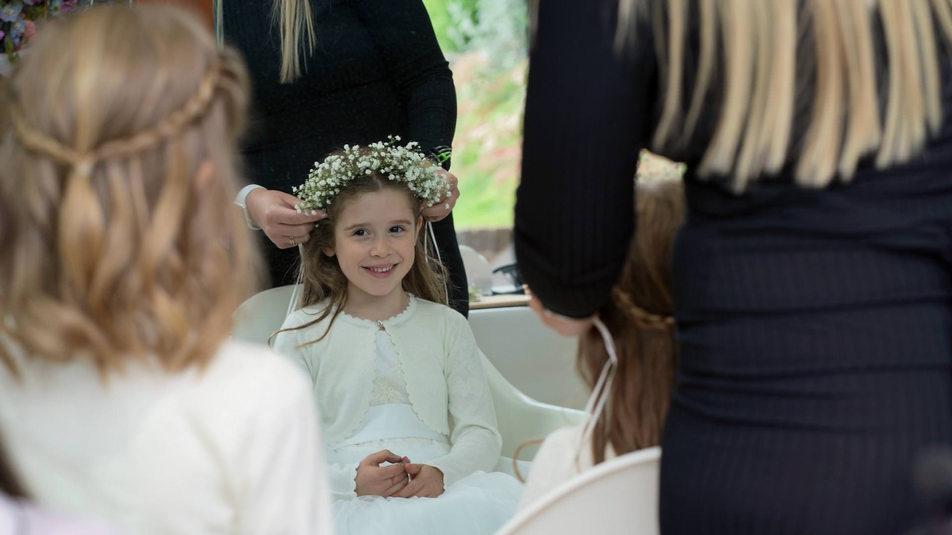 flower crown gets put on flowergirl