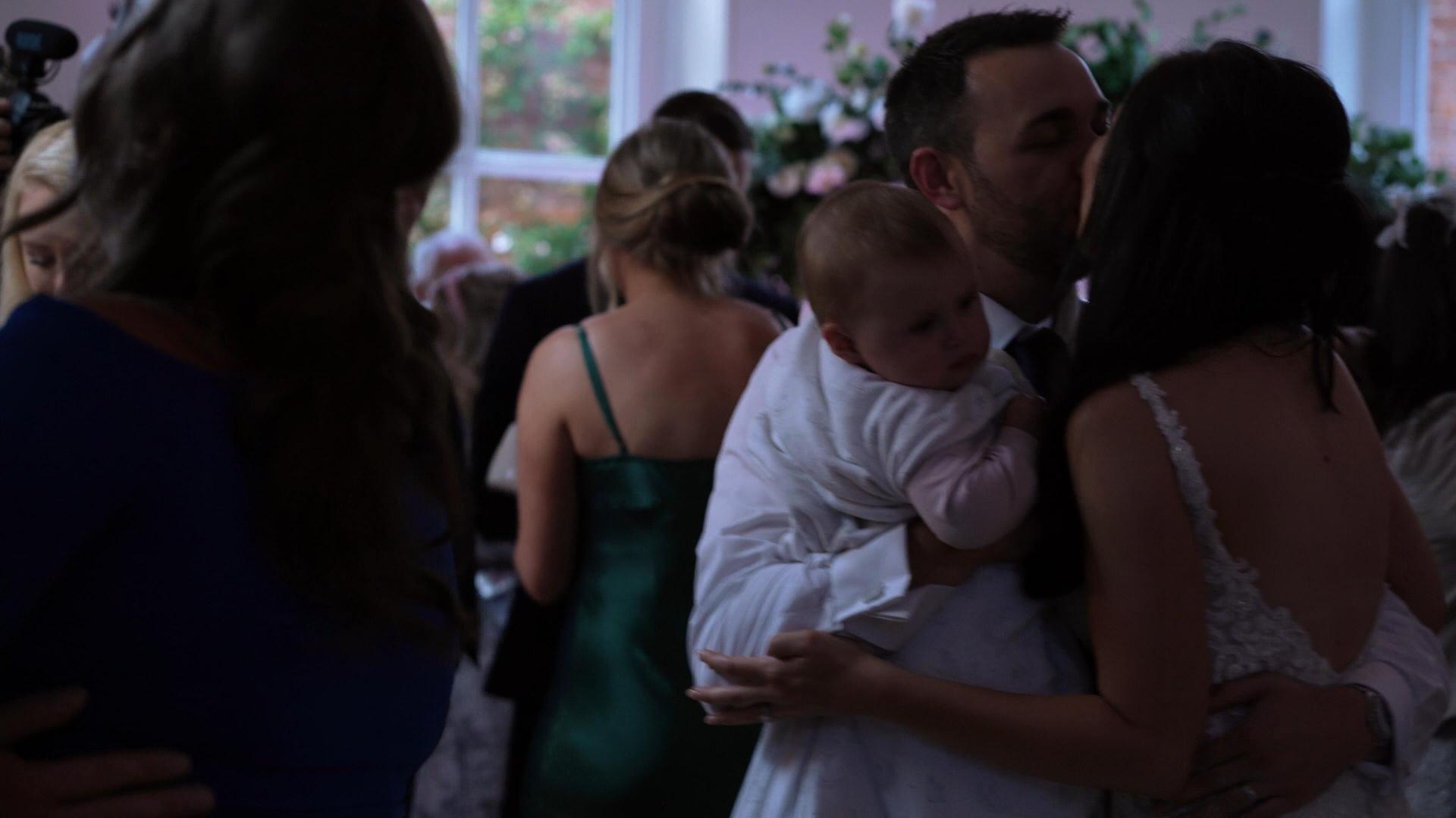 couple dance with daughter at Iscoyd Park evening reception