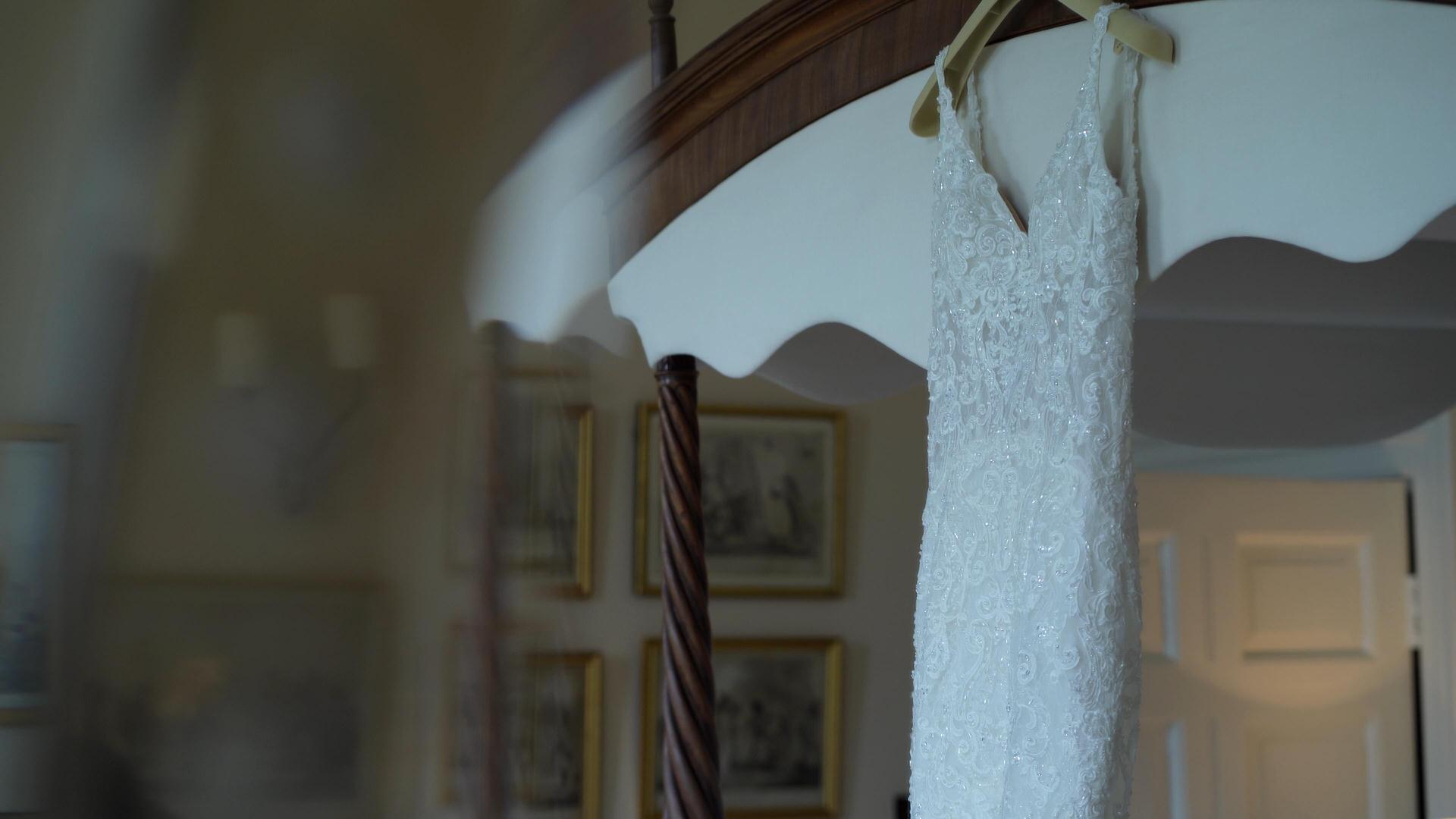 wedding dress hanging in Iscoyd park bedroom