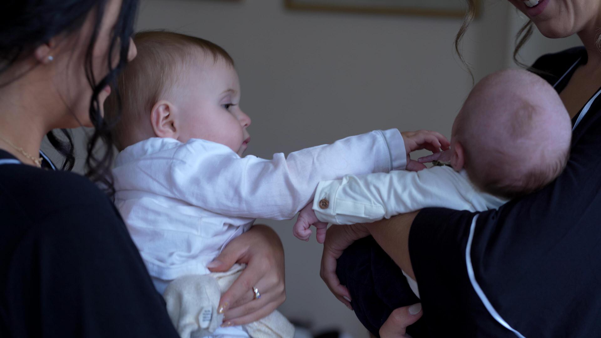 candid video still of babies on wedding morning