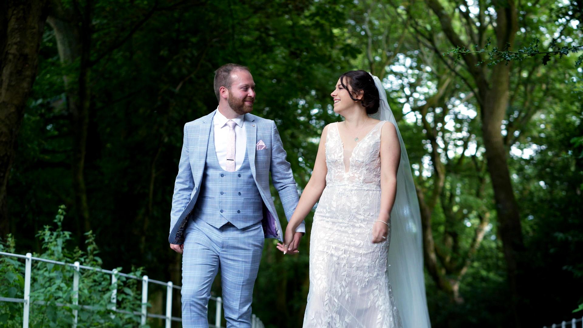 videographer films couple laughing and walking at Ashfield House