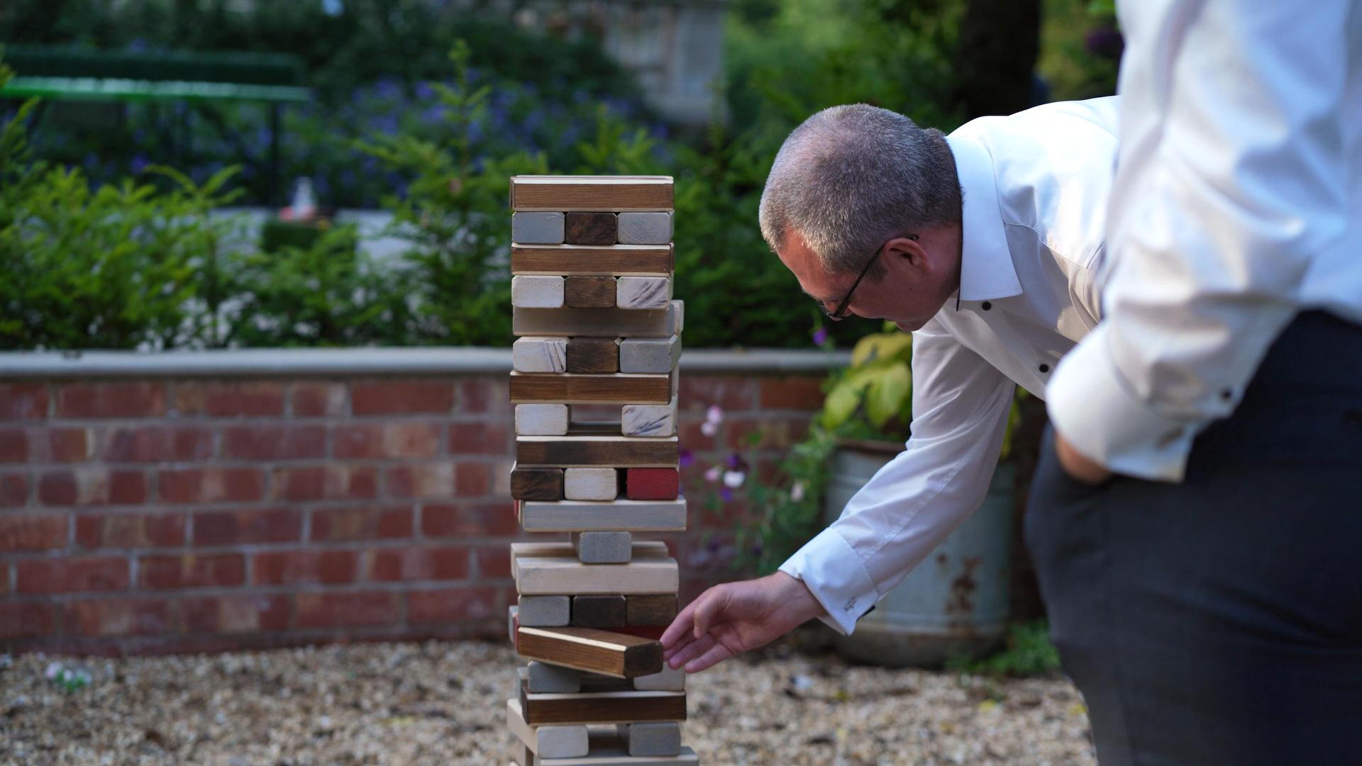 close up video of wedding guest playing giant jenga