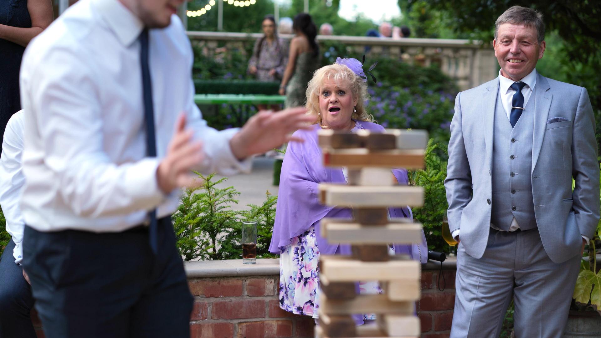 guest reaction to giant jenga at wedding