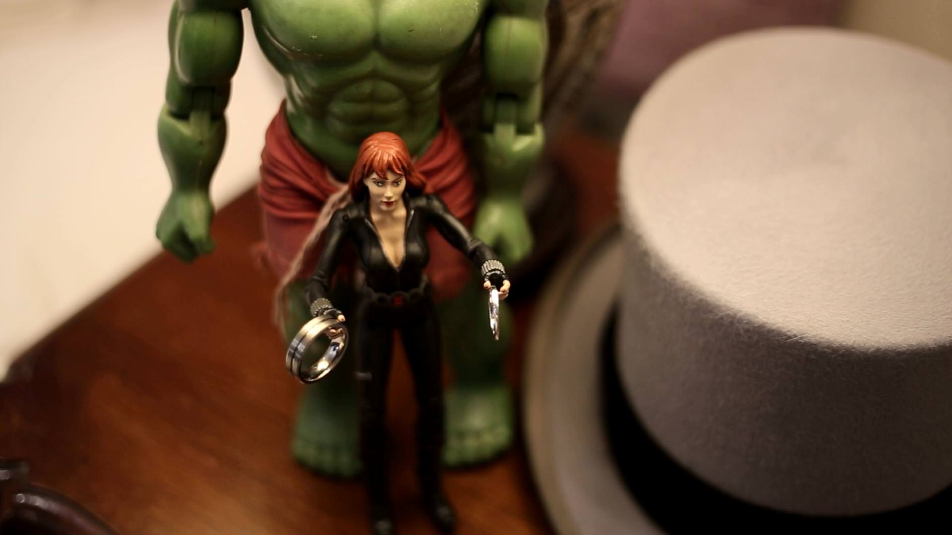 fun video still of black widow holding wedding rings
