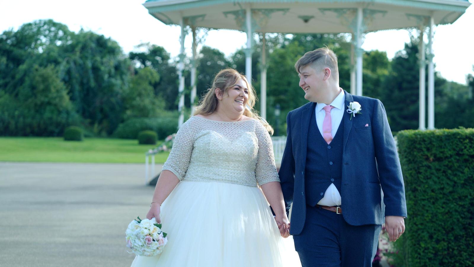 bride and groom walk past banstand at Isla Gladstone