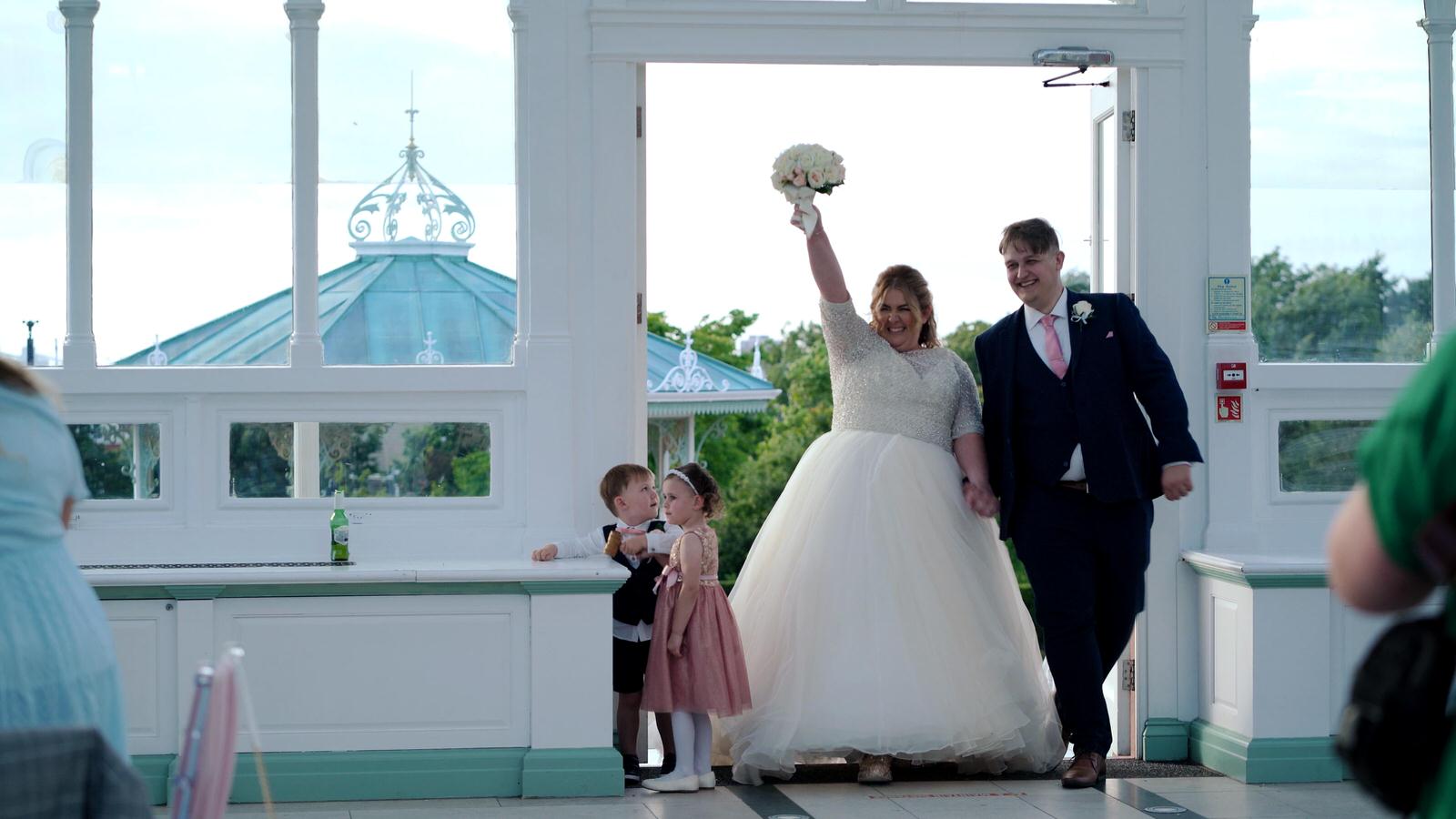 bride and grooms excited entrance to wedding reception at Isla Gladstone