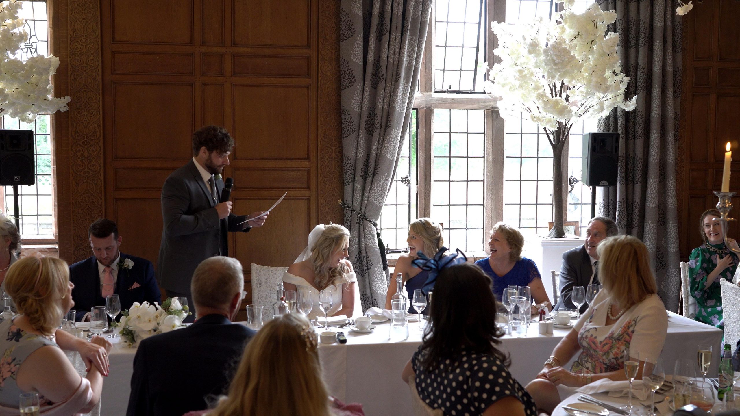 groom makes everyone laugh during wedding speech