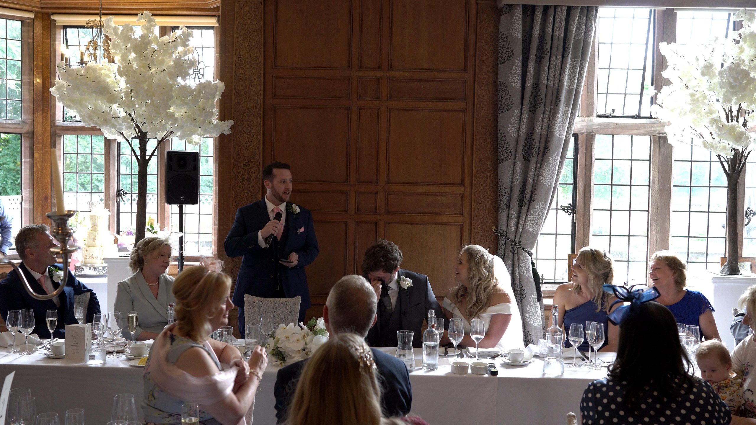 nervous best man stands for wedding speech
