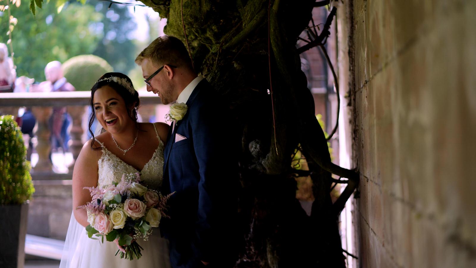 couple laugh during photos at wedding