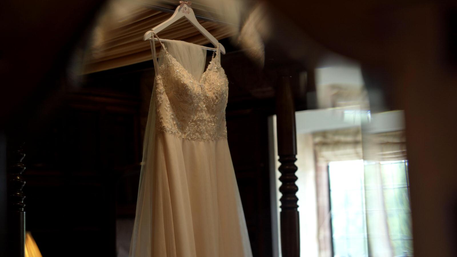 wedding dress hangs in inglewood manor bridal suite