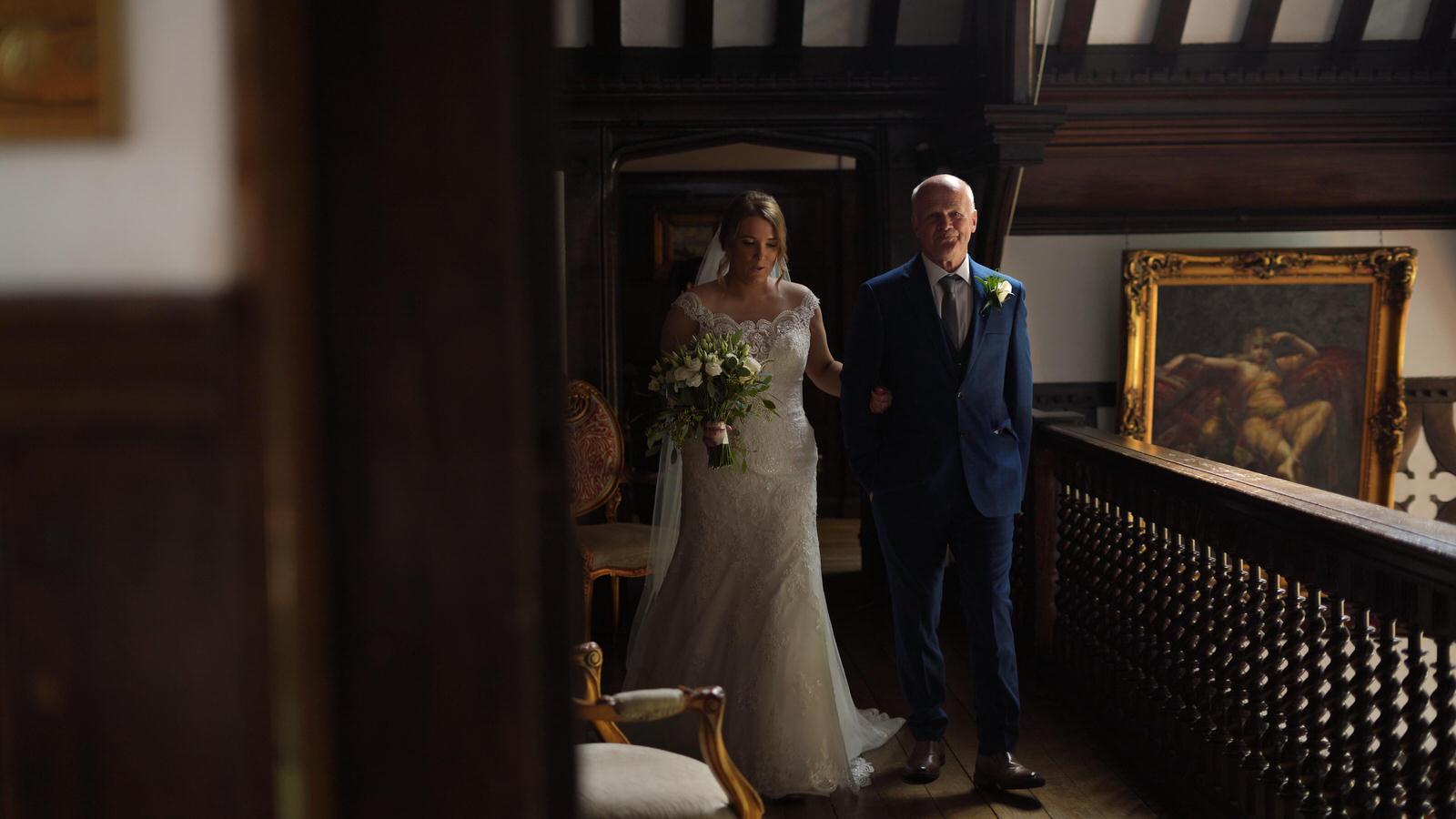 bride looks nervous walking across balcony at Hillbark hotel