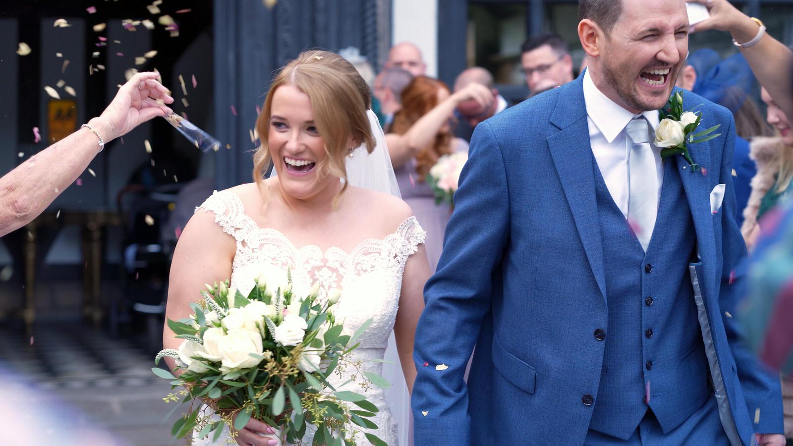close up of couple smiling during confetti