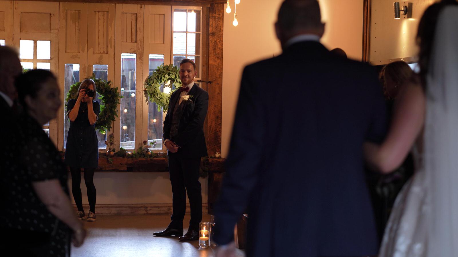 first look from groom during wedding ceremony