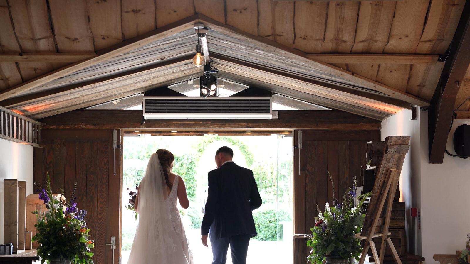 candid video of couple walking out of owen house barn