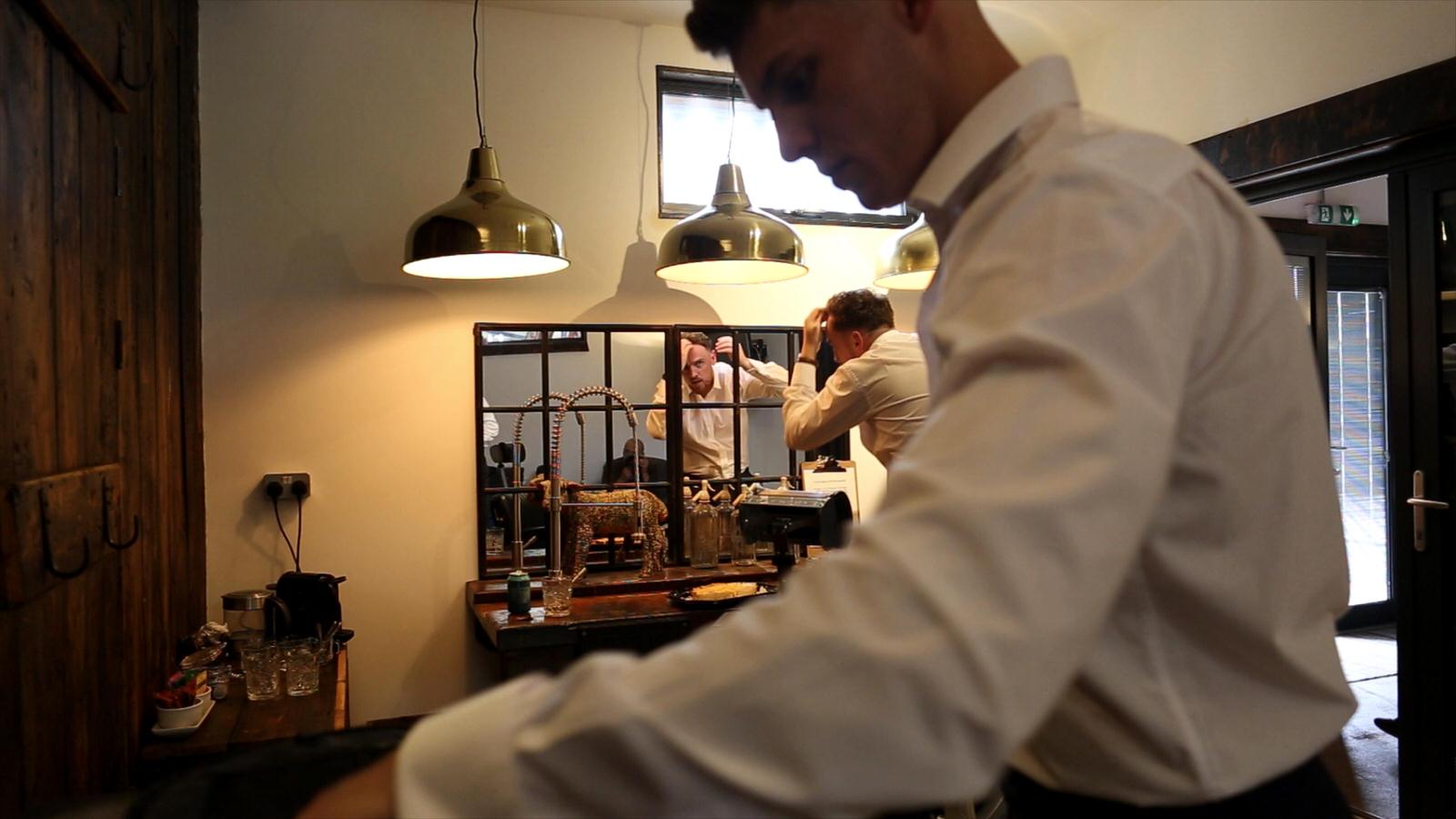 groom gets ready at owen house wedding barn