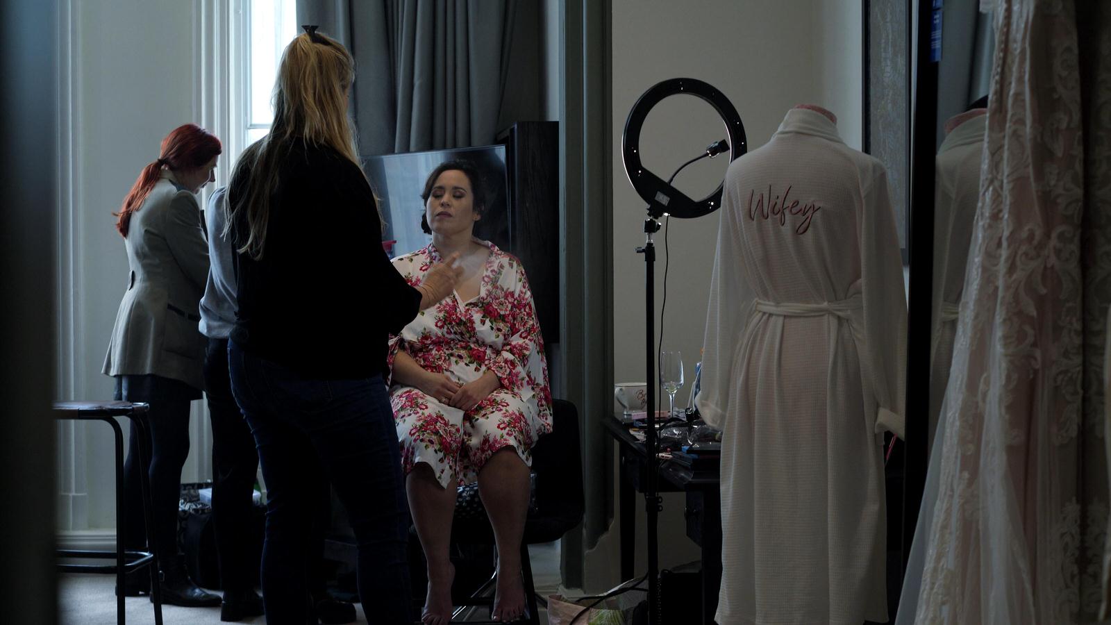 bride having makeup done at doubletree hilton