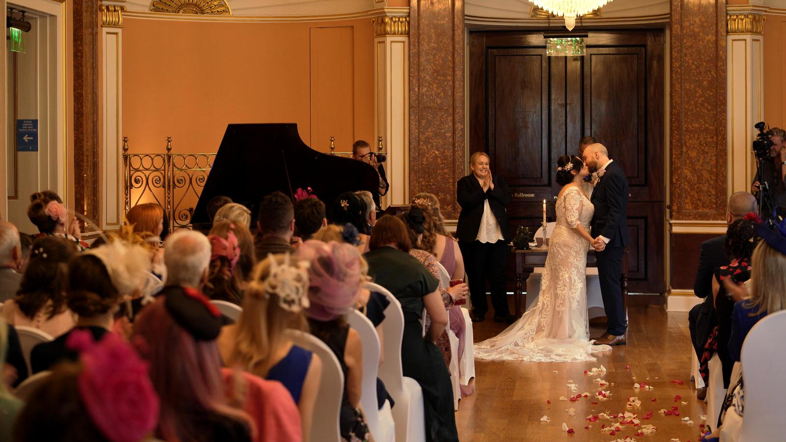 couple kiss during town hall wedding